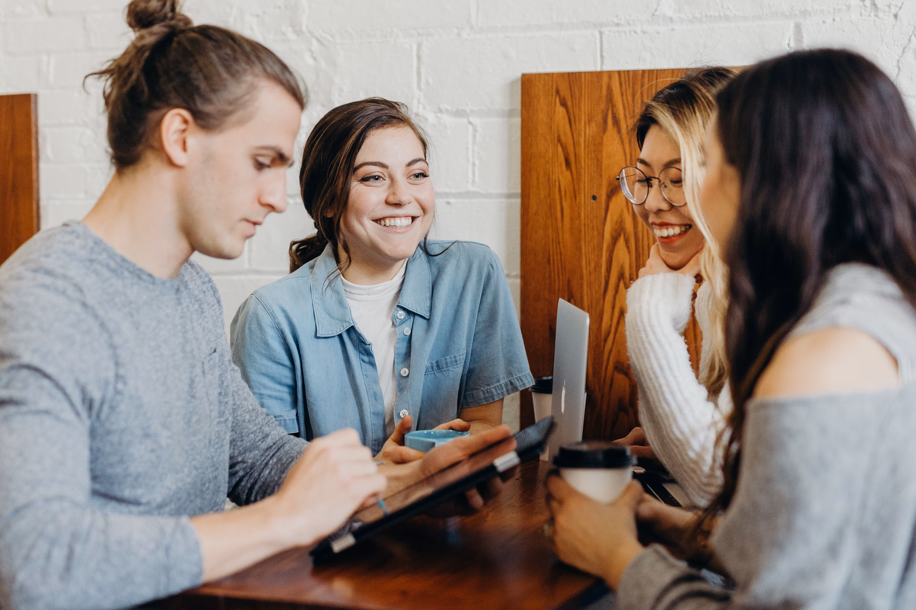 Woman laughing while looking at another person